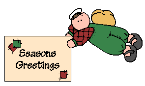 Boy holding Season's Greeting's sign
